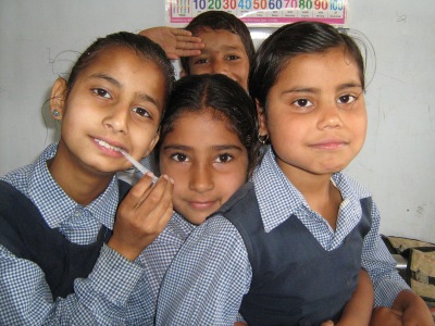 Volunteer teaching English in a local school classroom