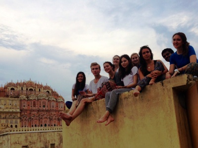 Travelers exploring Indian cultural sites after volunteer work